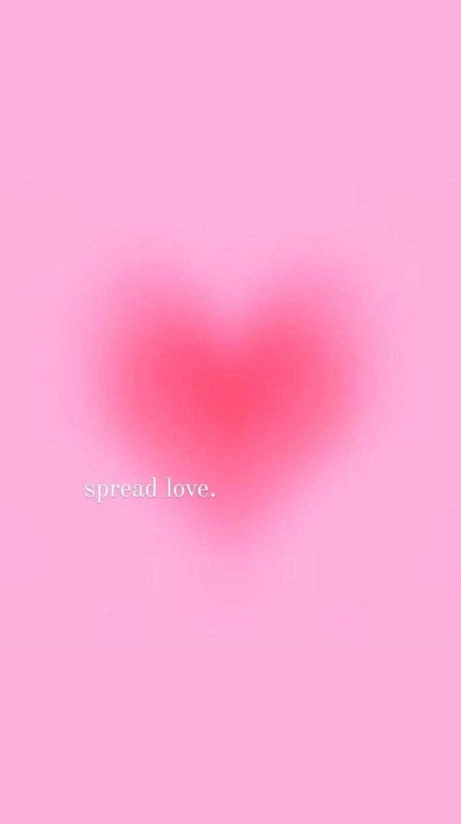 A Pink Heart With The Words Spread Love Wallpaper