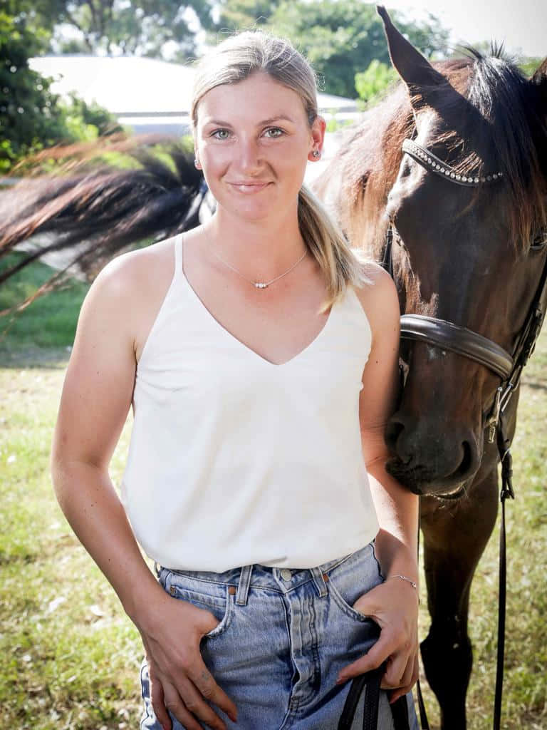 Jamie Kah Champion Jockey In Action Wallpaper
