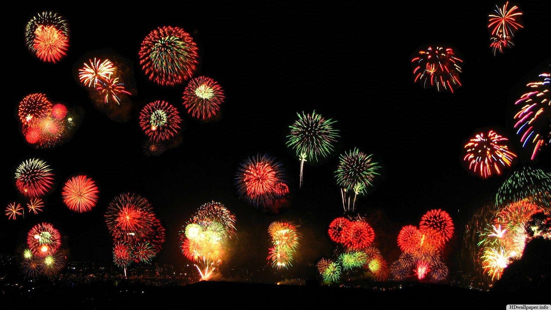 Fireworks light up the night sky in a vibrant display, celebrating the New Year