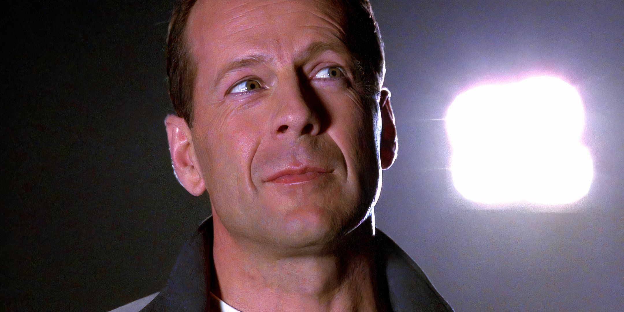 A close-up of a man's face, possibly an actor, with a thoughtful expression