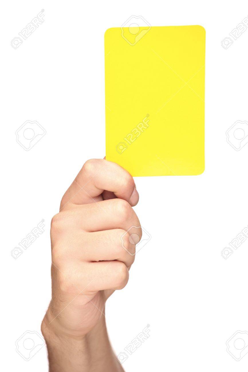 Hand Holding A Yellow Card Isolated On White Background Stock