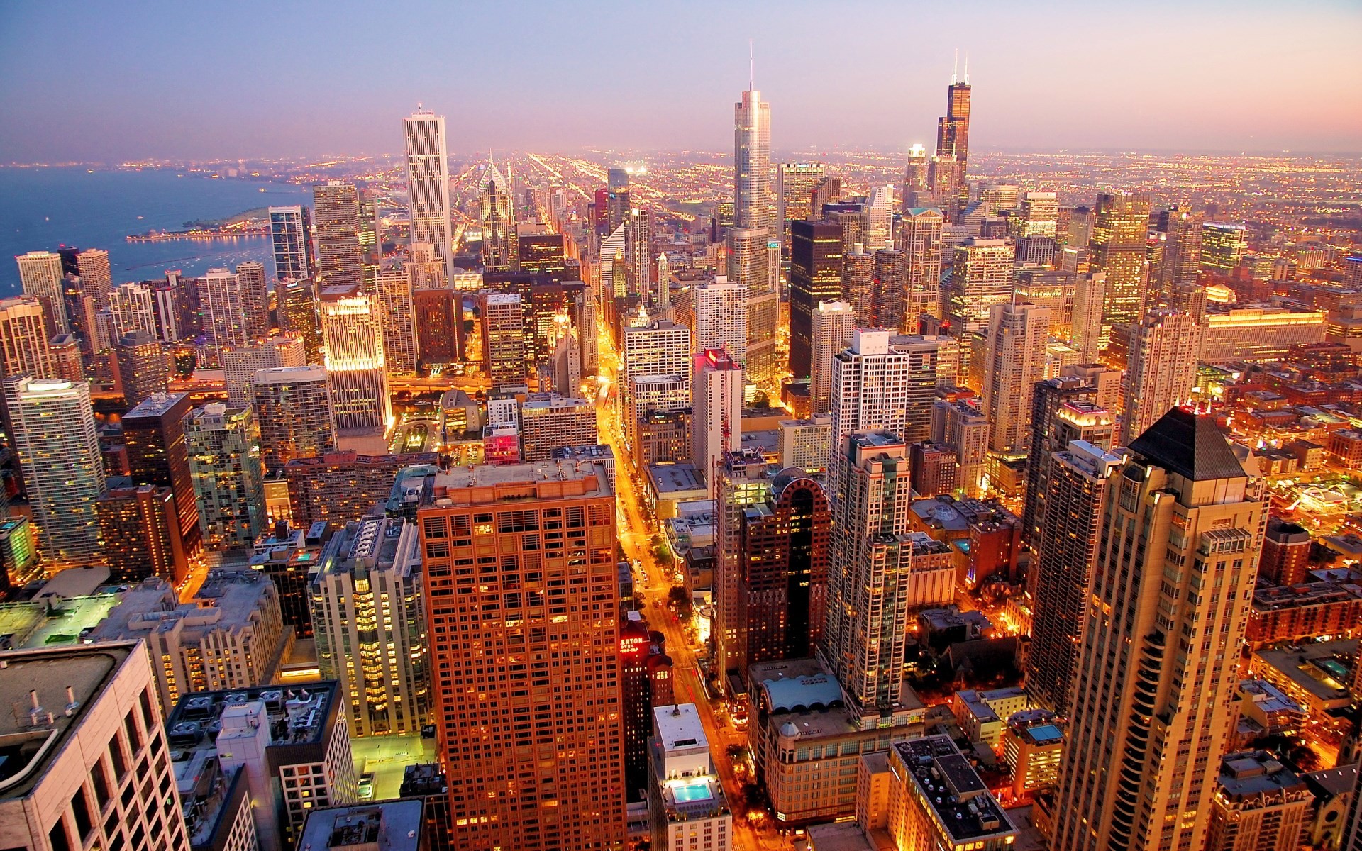 Stunning aerial view of the Chicago skyline at dusk, showcasing the city's iconic skyscrapers and vibrant cityscape