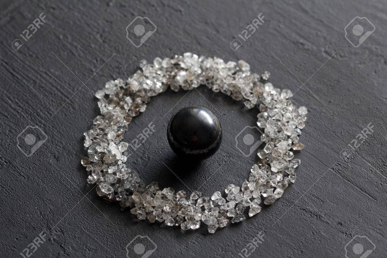 Scattered Diamonds On A Black Background Raw And Mining