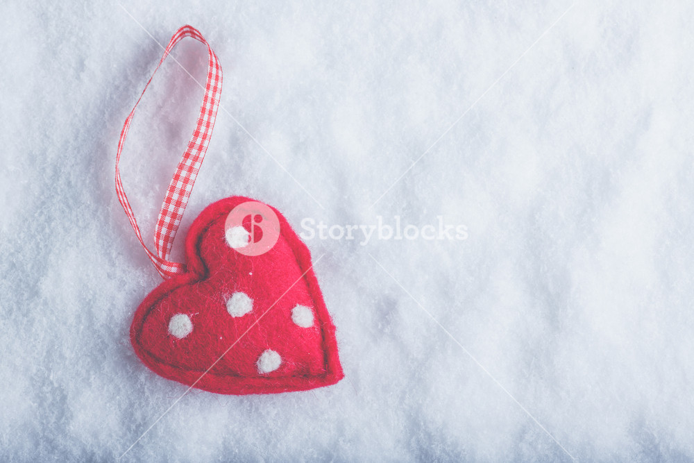 Red Toy Suave Heart On A Frosty White Snow Winter Background