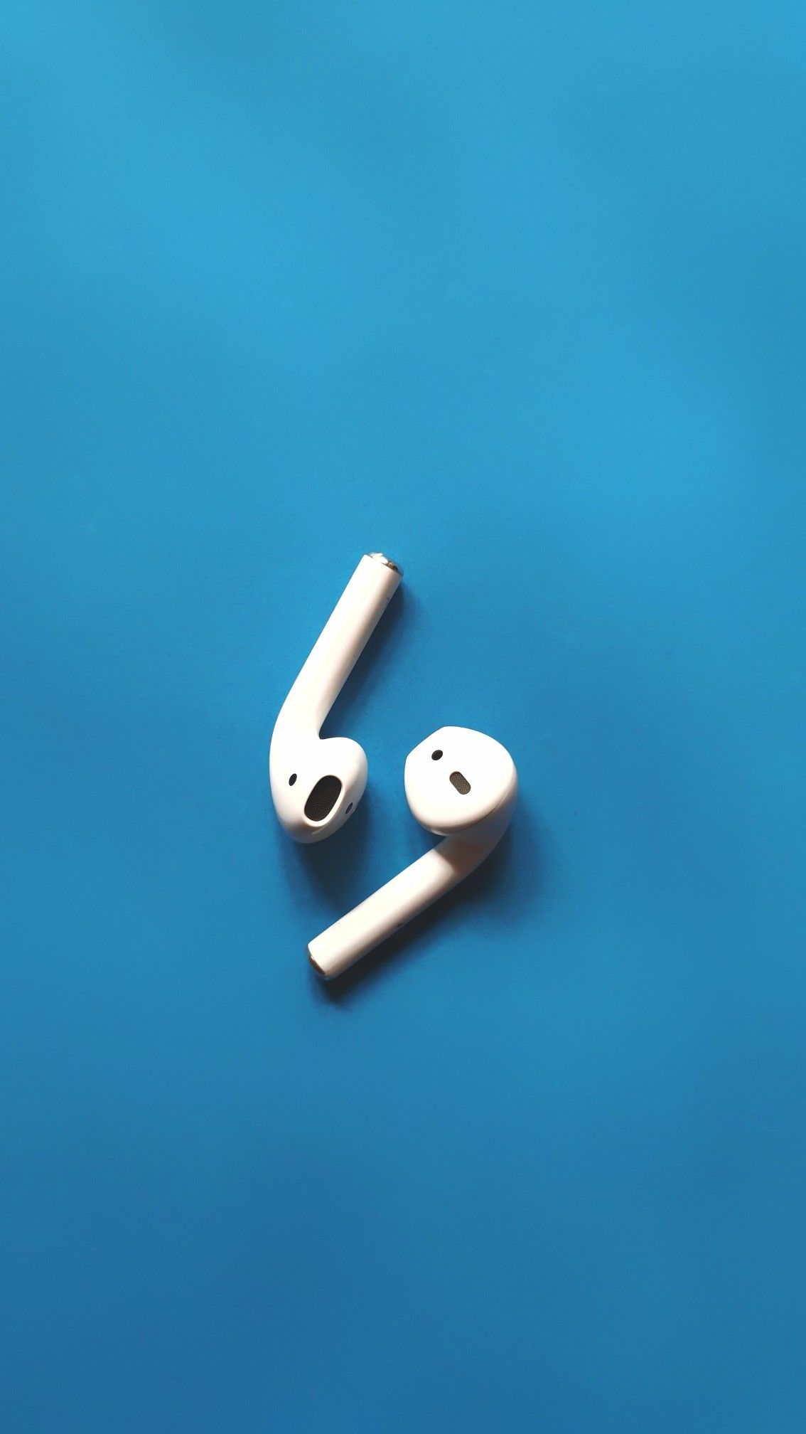White Apple Airpods Headphones Wallpaper In Blue And