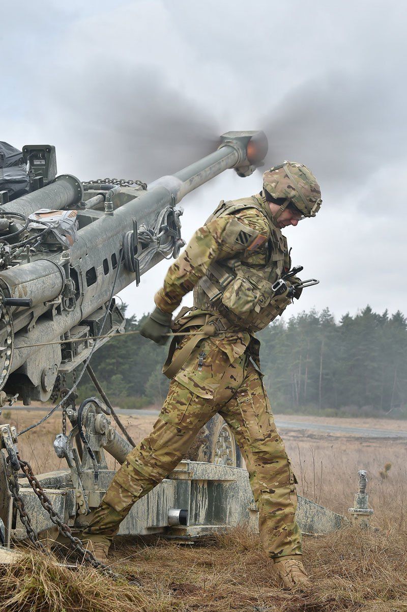U S Army Spc Vincent Ventarola Pulls The Lanyard On A M777