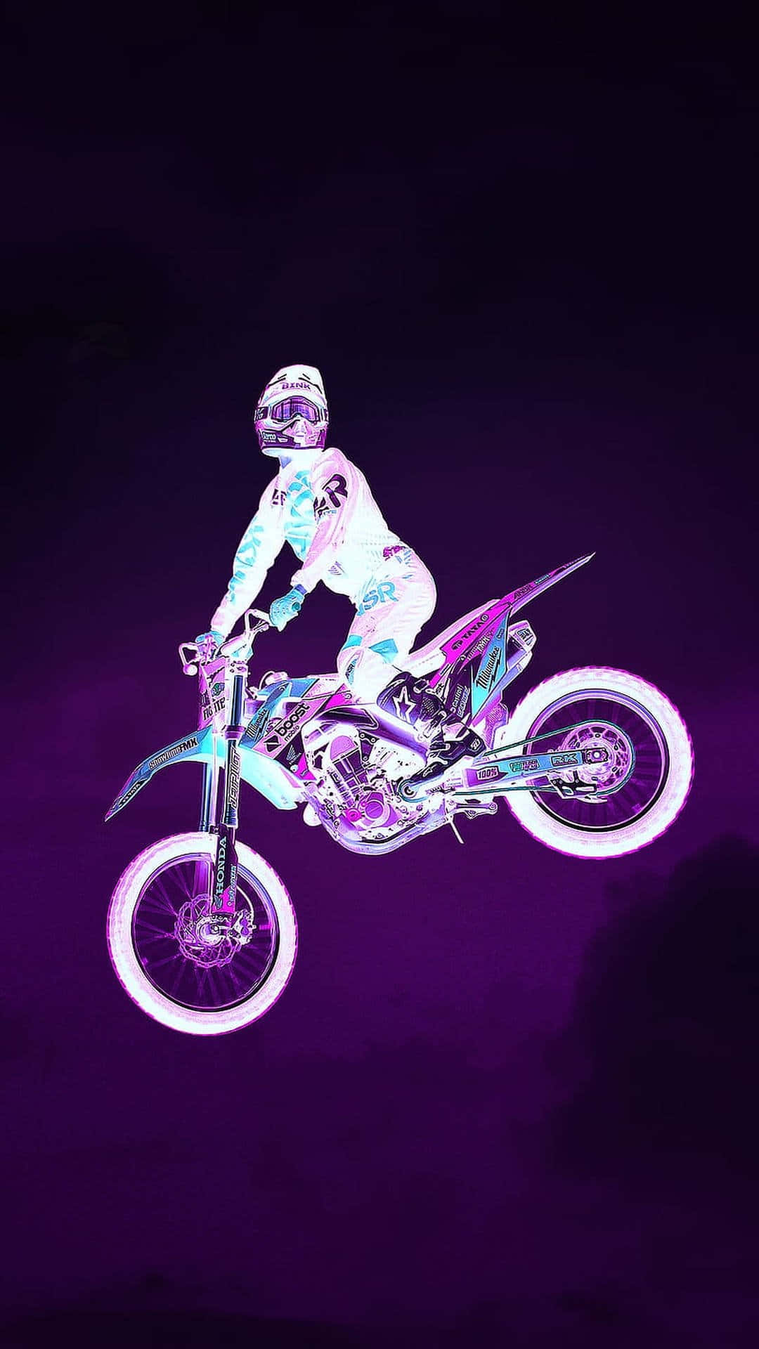 A Person Riding Dirt Bike In The Air Wallpaper