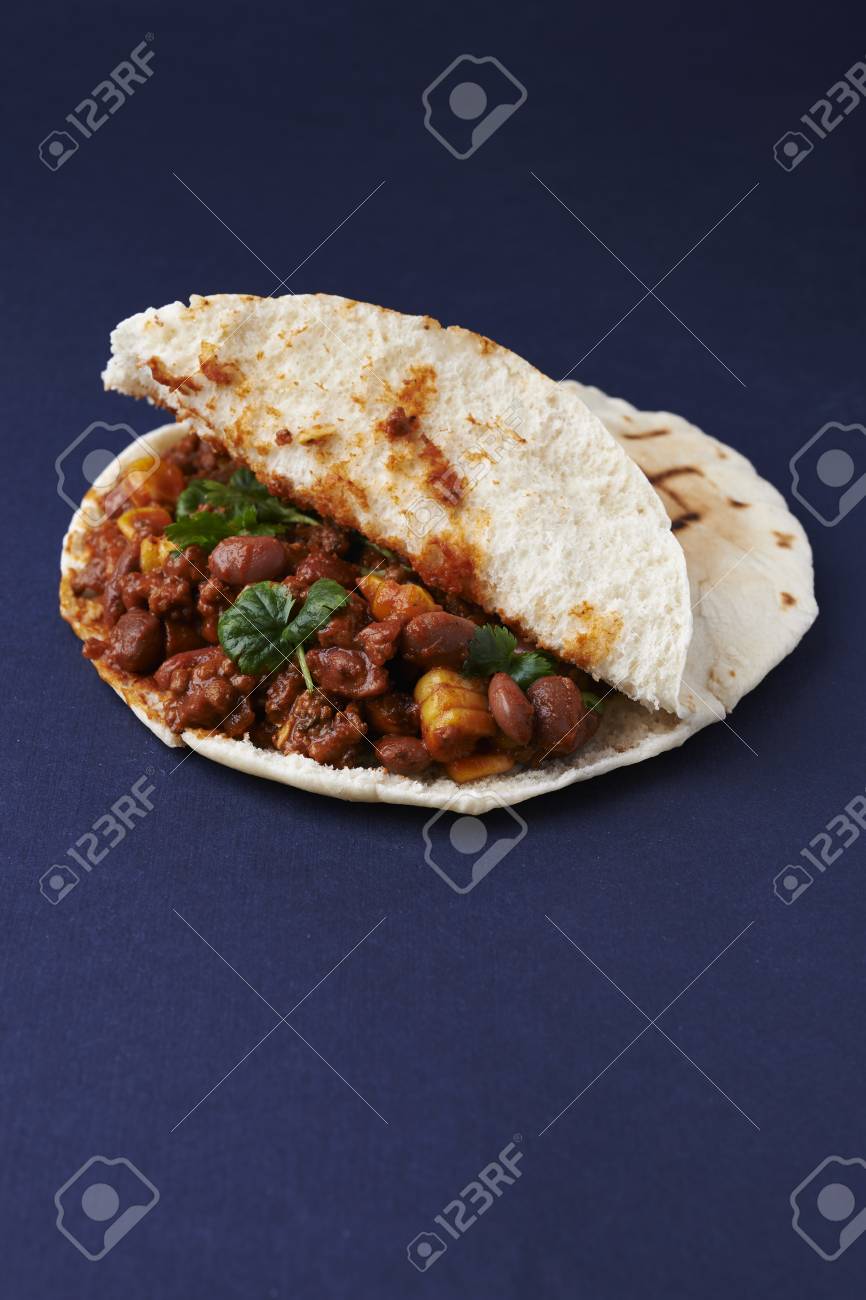 Flatbread With Meanced Meat Corn And Beans On Blue Background