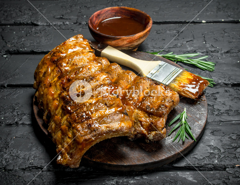 Grilled Ribs With Sauce On A Black Rustic Background Royalty