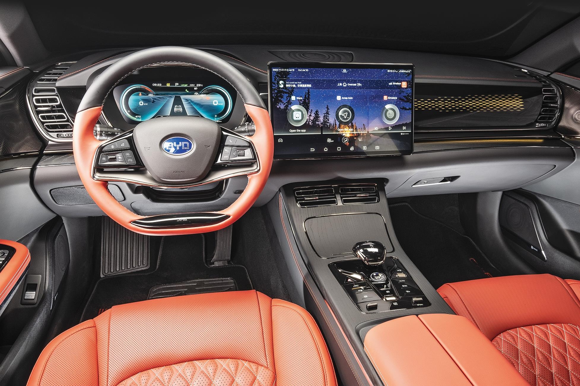 Interior view of a BYD electric car, showcasing the dashboard, steering wheel, and infotainment system