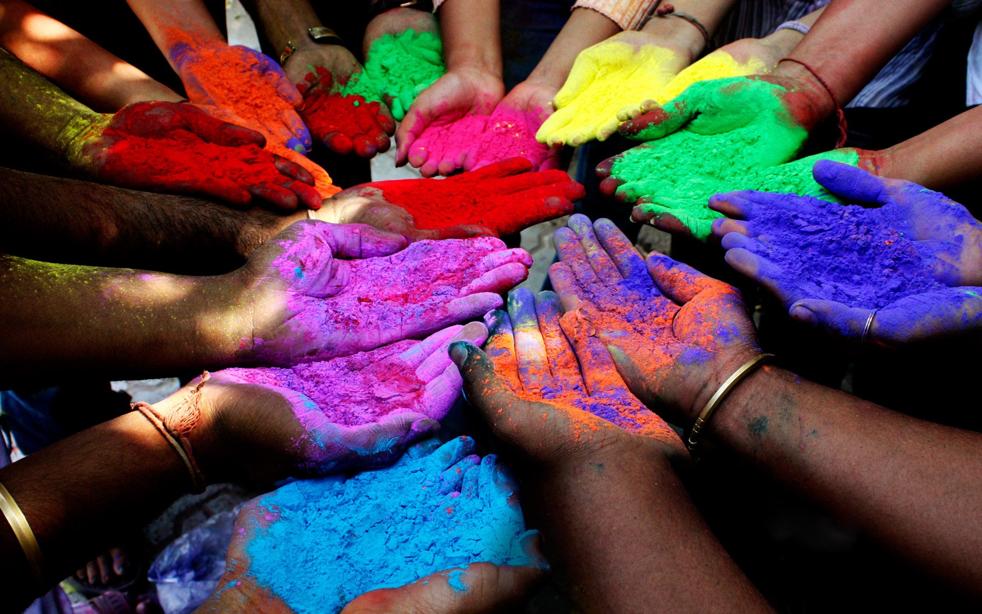 Vibrant Hands Of Holi Wallpaper