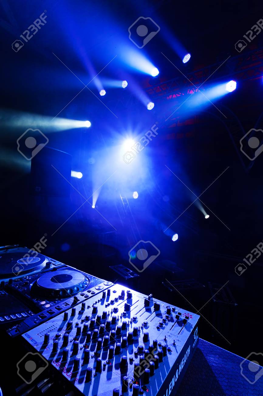 Dj Mixer With Laser In The Background At Outdoors Concert Stock