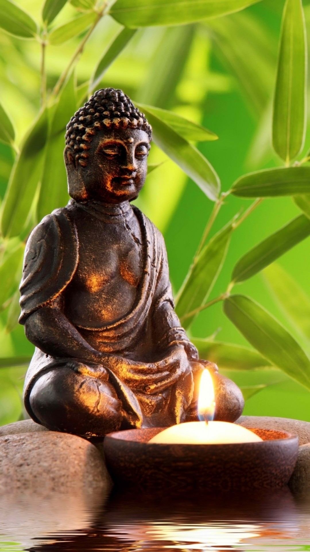 Serene Buddha Statue with Candle and Bamboo