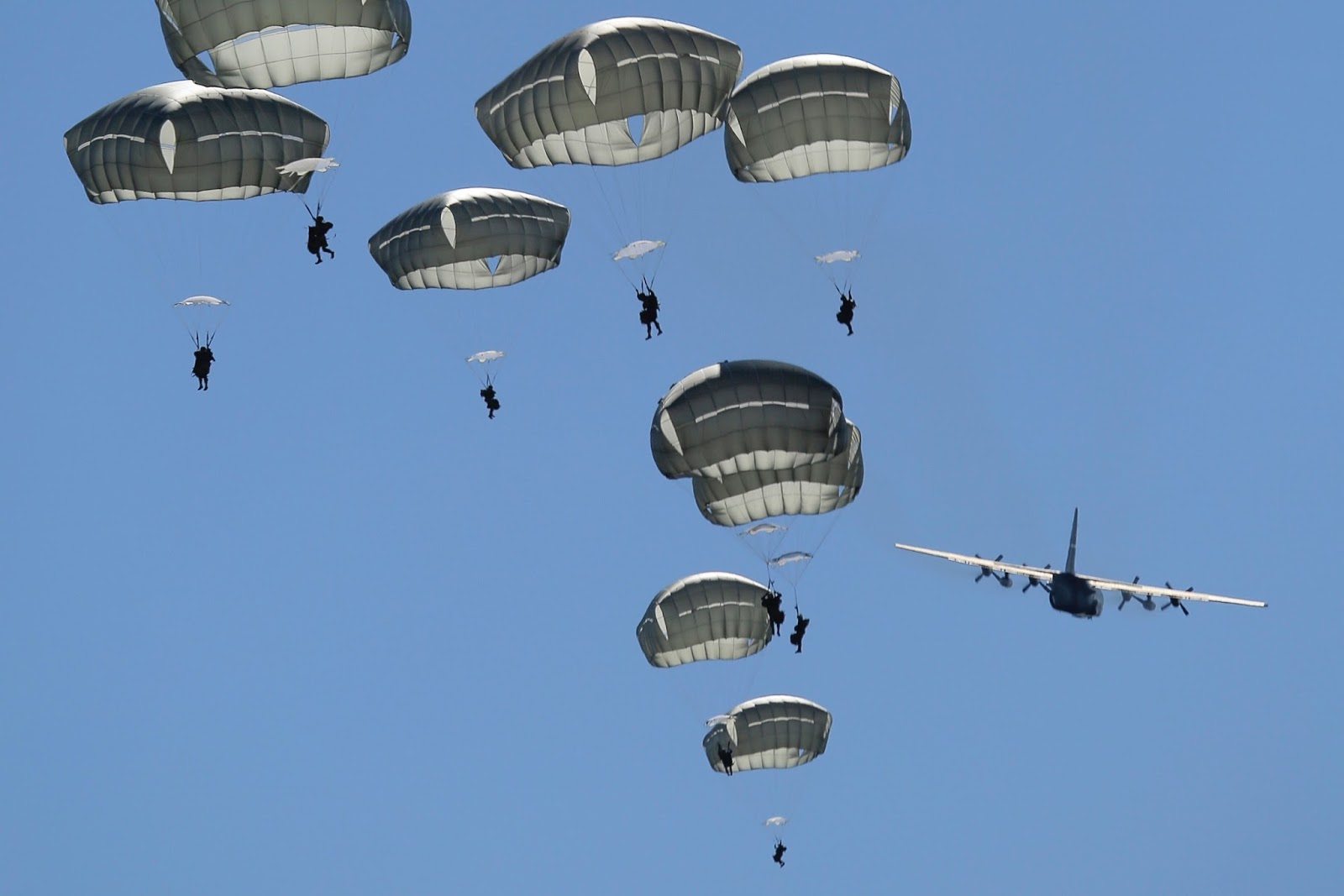 Paratroopers Jumping Out Of Lockheed C Hercules Aircraft