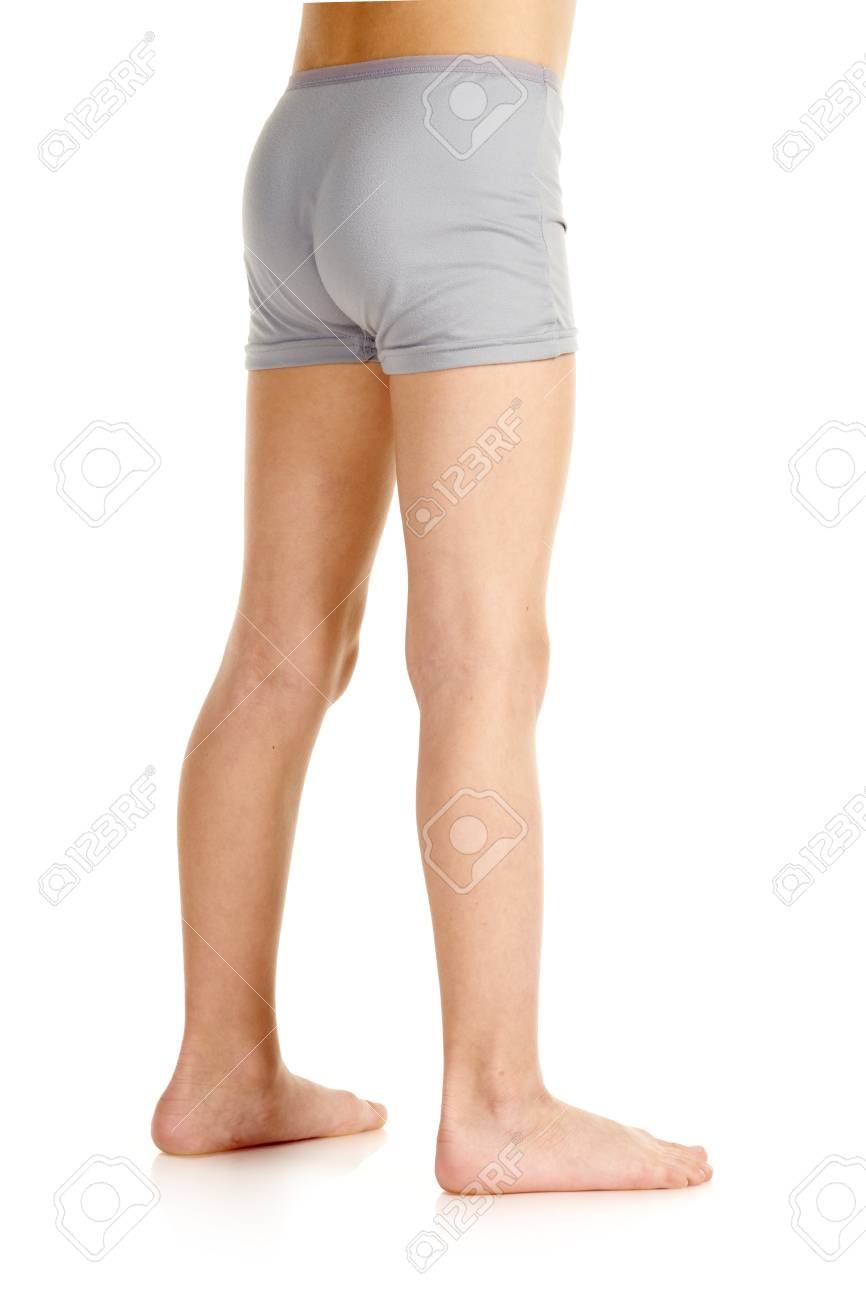 Barefoot Young Boy In Underwear Standing On White Background Stock