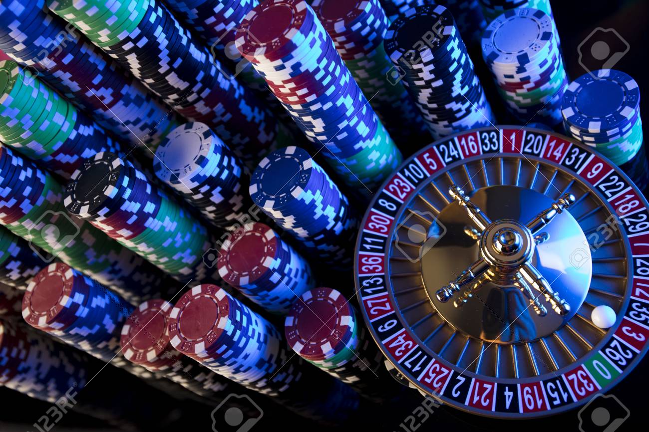 Casino Blurred Background Roulette And Stacks Of Chips Stock