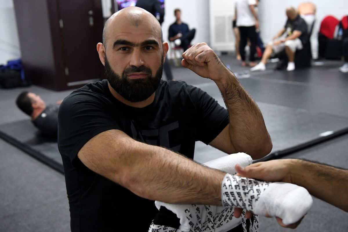 Professional Fighter Shamil Abdurakhimov Wrapping His Hands Wallpaper