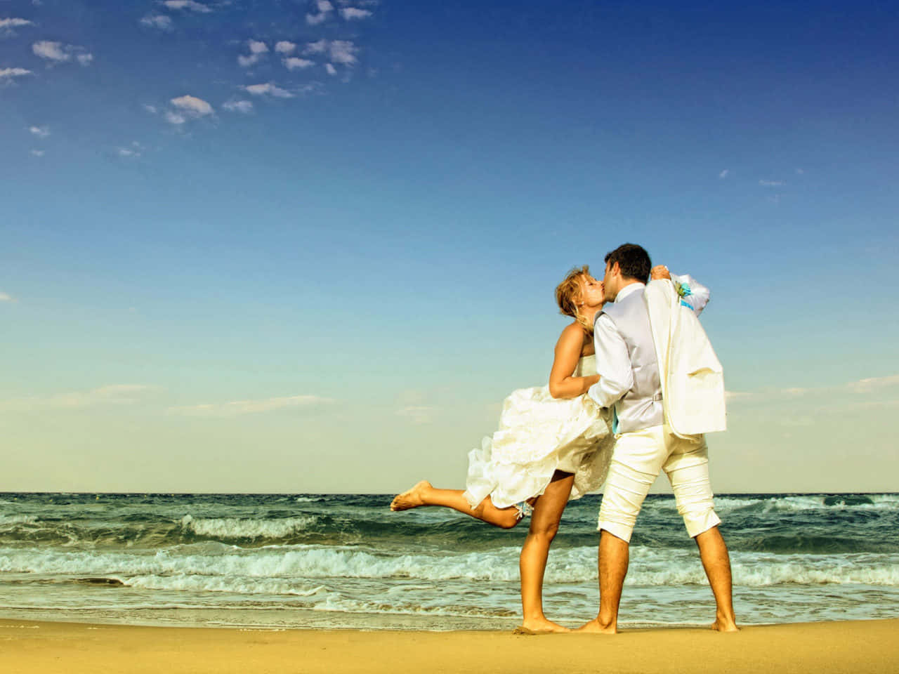 Couple At Beach Kissing Under Blue Sky Picture Wallpaper