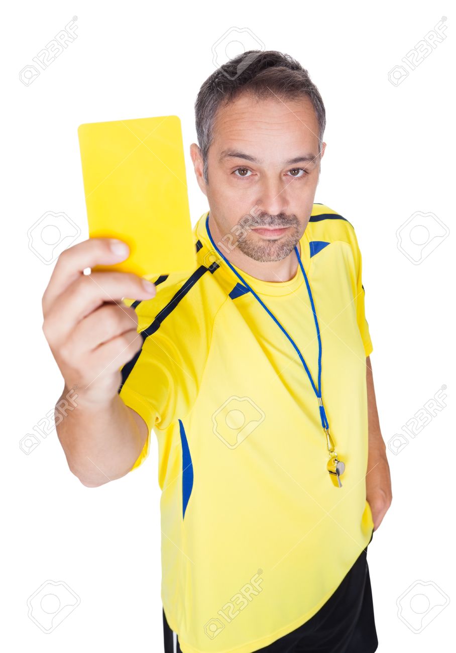 Soccer Referee Showing Yellow Card On White Background Stock Photo