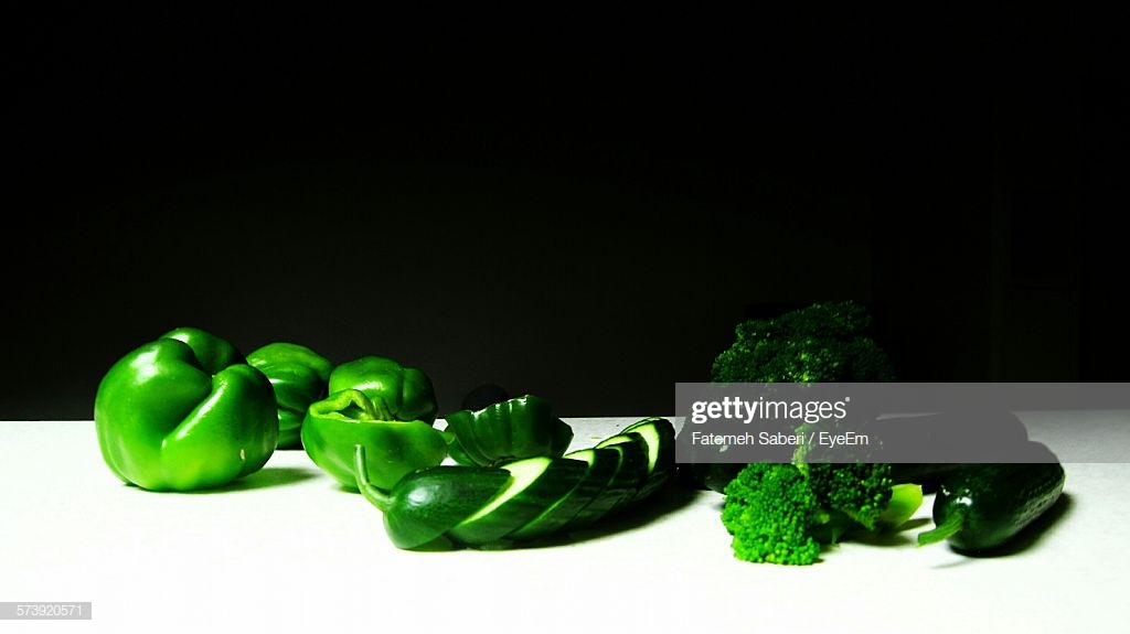 Chopped Vegetables On Table Against Black Background Stock Photo