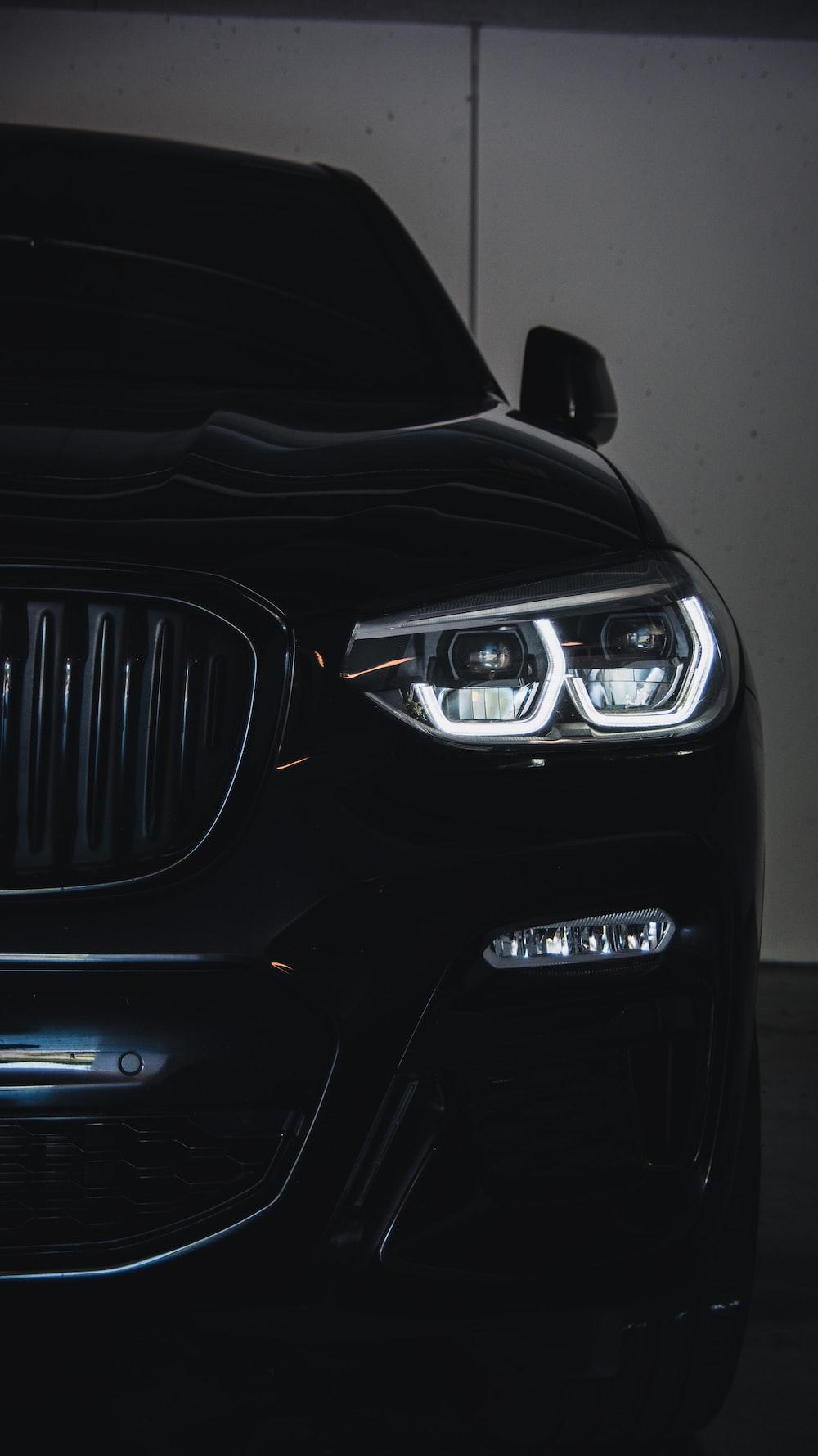 Black Bmw Car In Front Of White Wall Photo Grey Image On