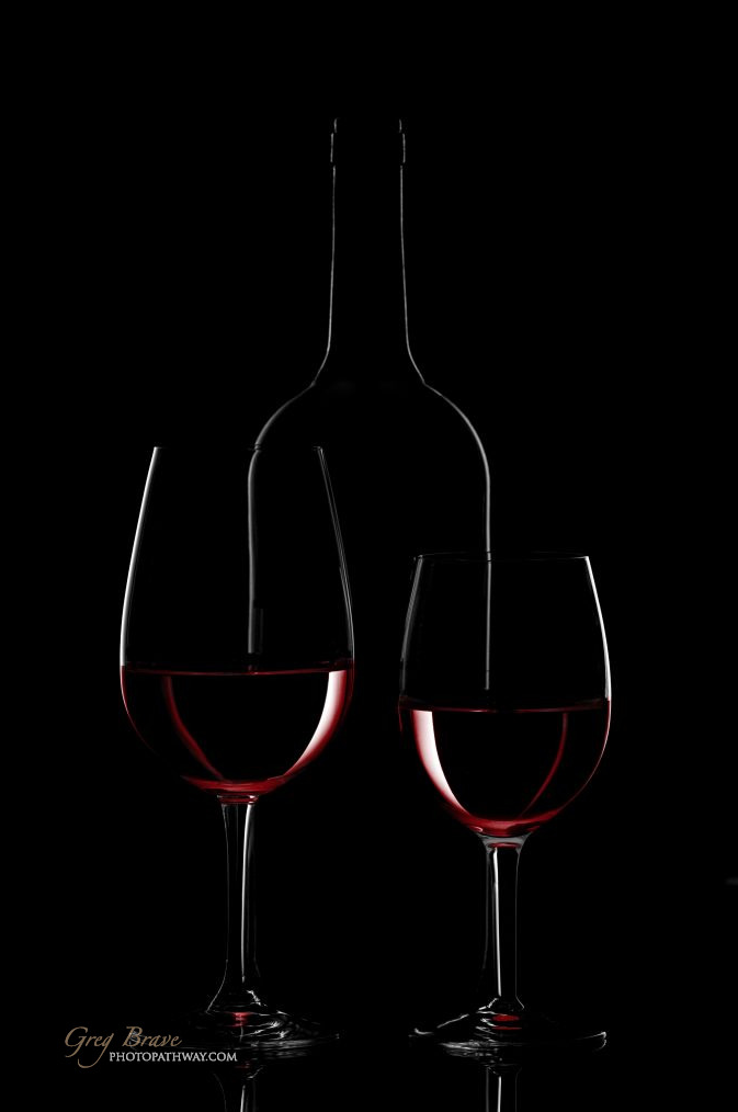 Red Wine Bottle And Glass On Black Background