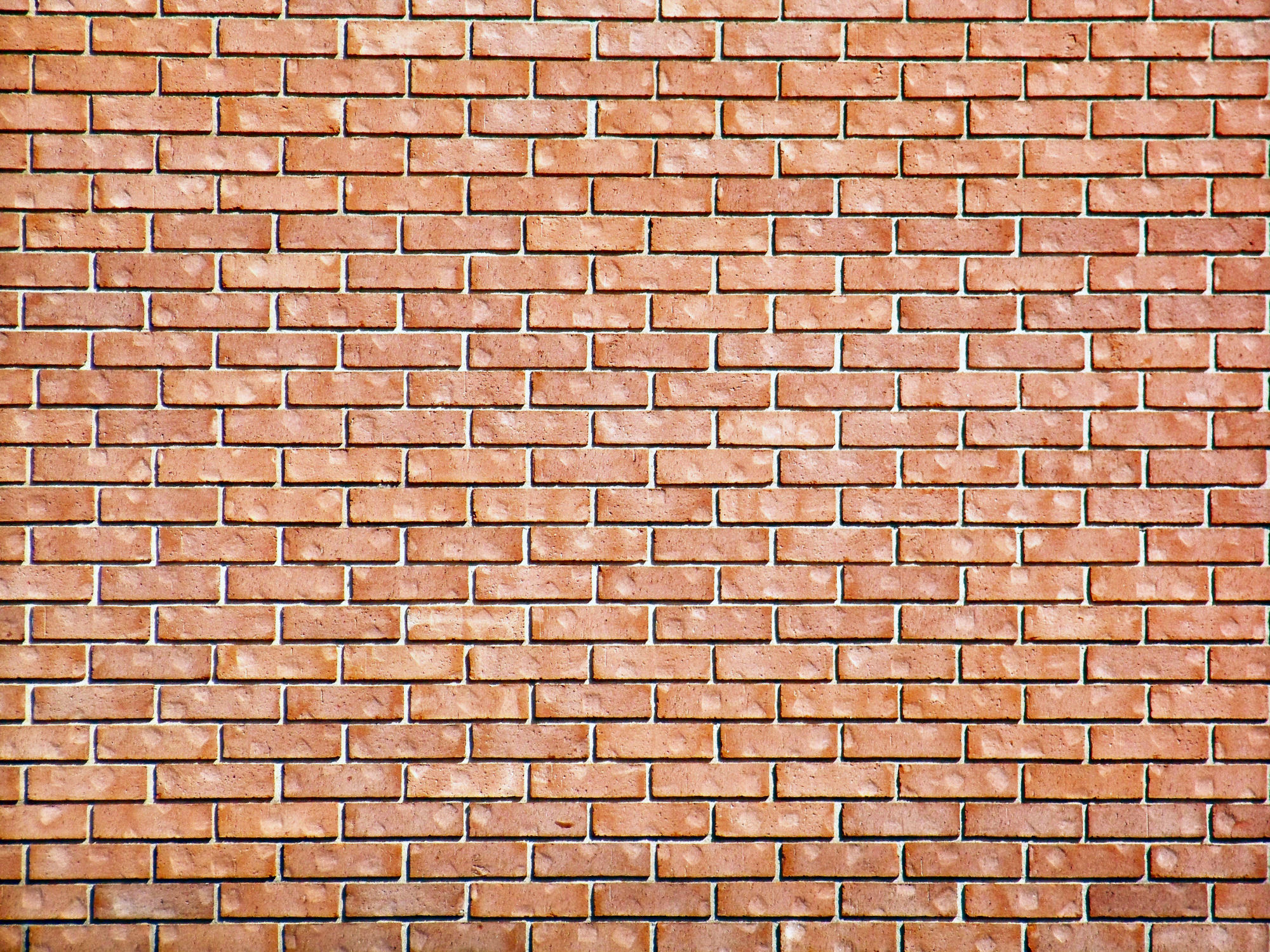 Brick Wall Of Light Red Bricks Suitable For A Background Or Matte