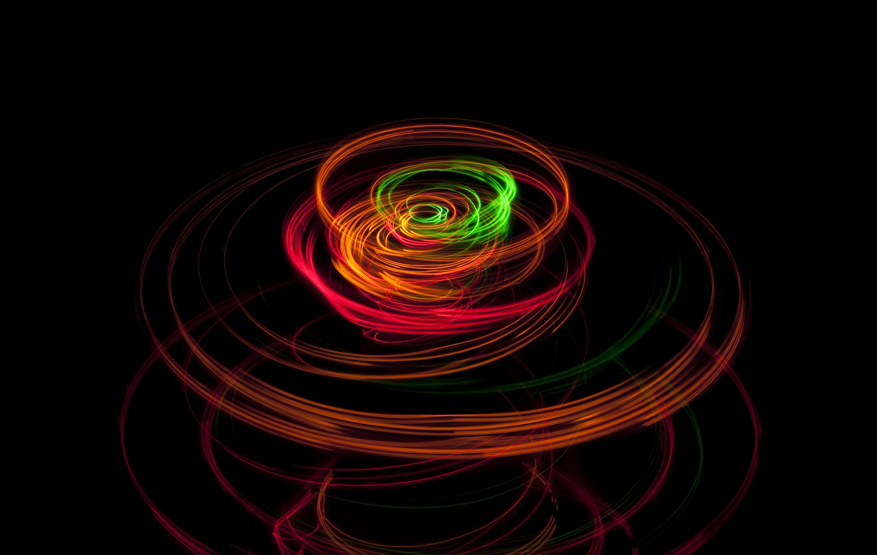 A Long Exposue Image Of Colorful Lights Tracing Circular