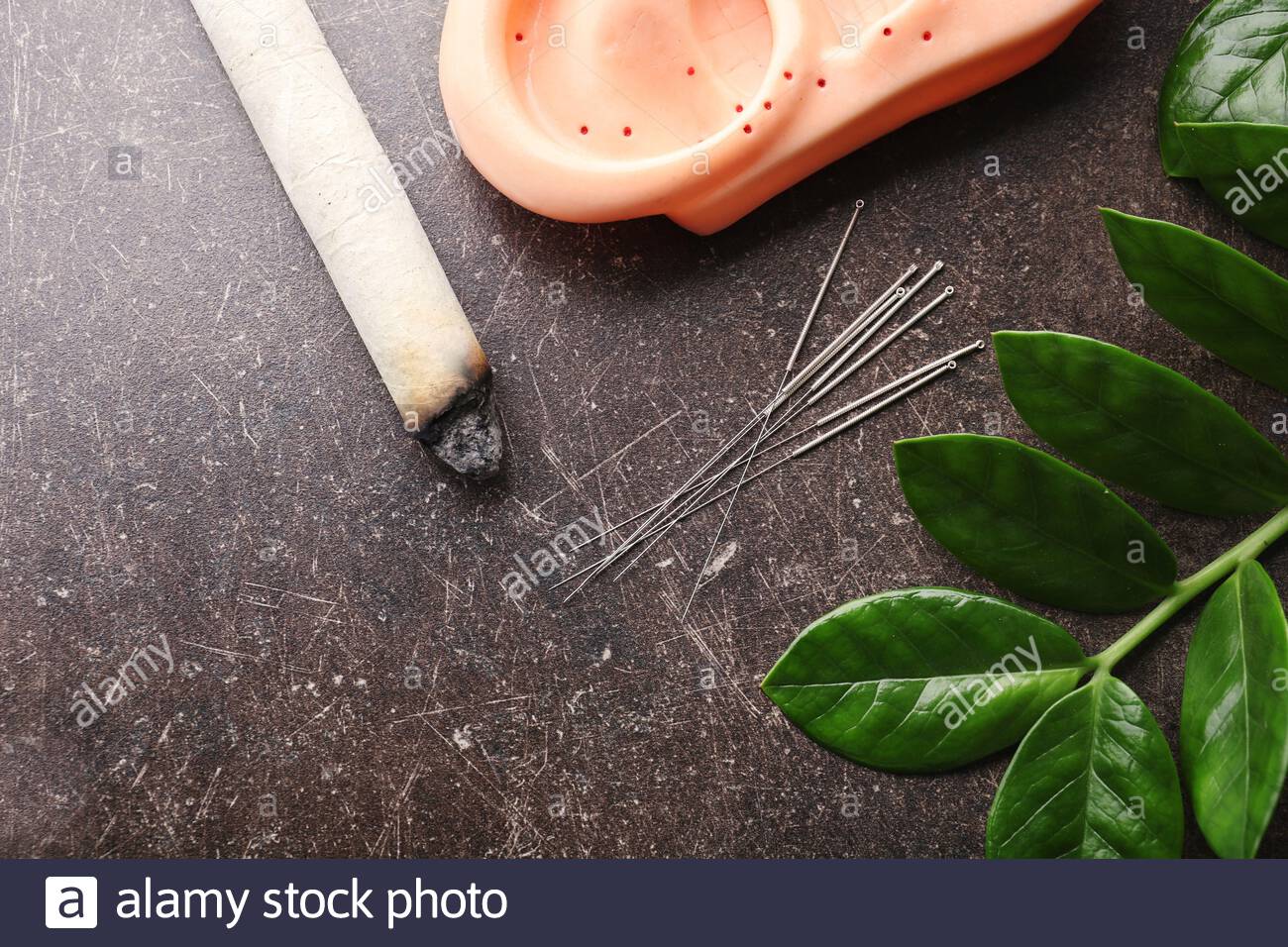 Free download Composition with acupuncture supplies on dark textured