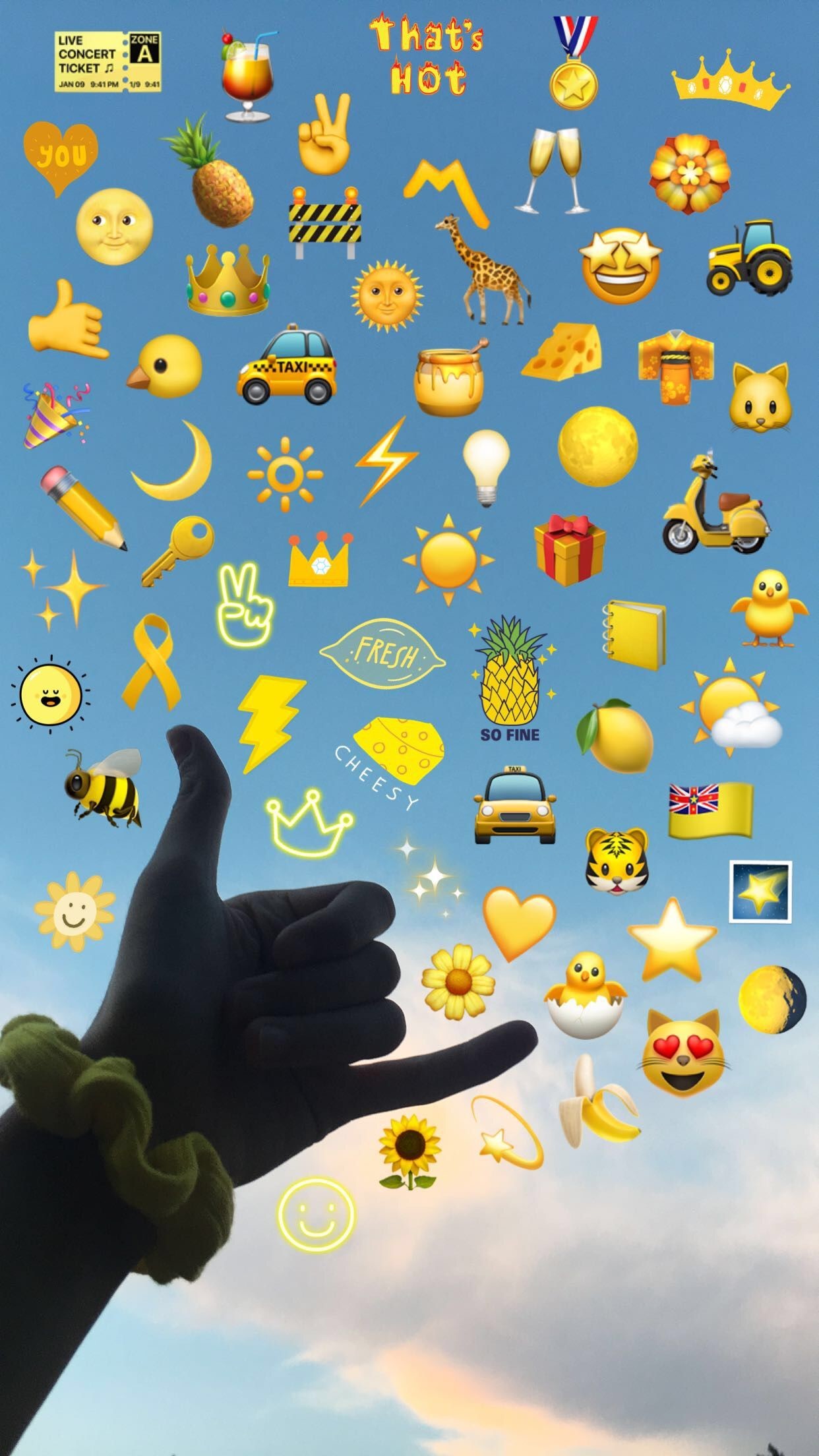 A hand forming a 'hang loose' gesture against a blue sky with various yellow emojis superimposed, including suns, moons, stars, food items, animals, and symbols