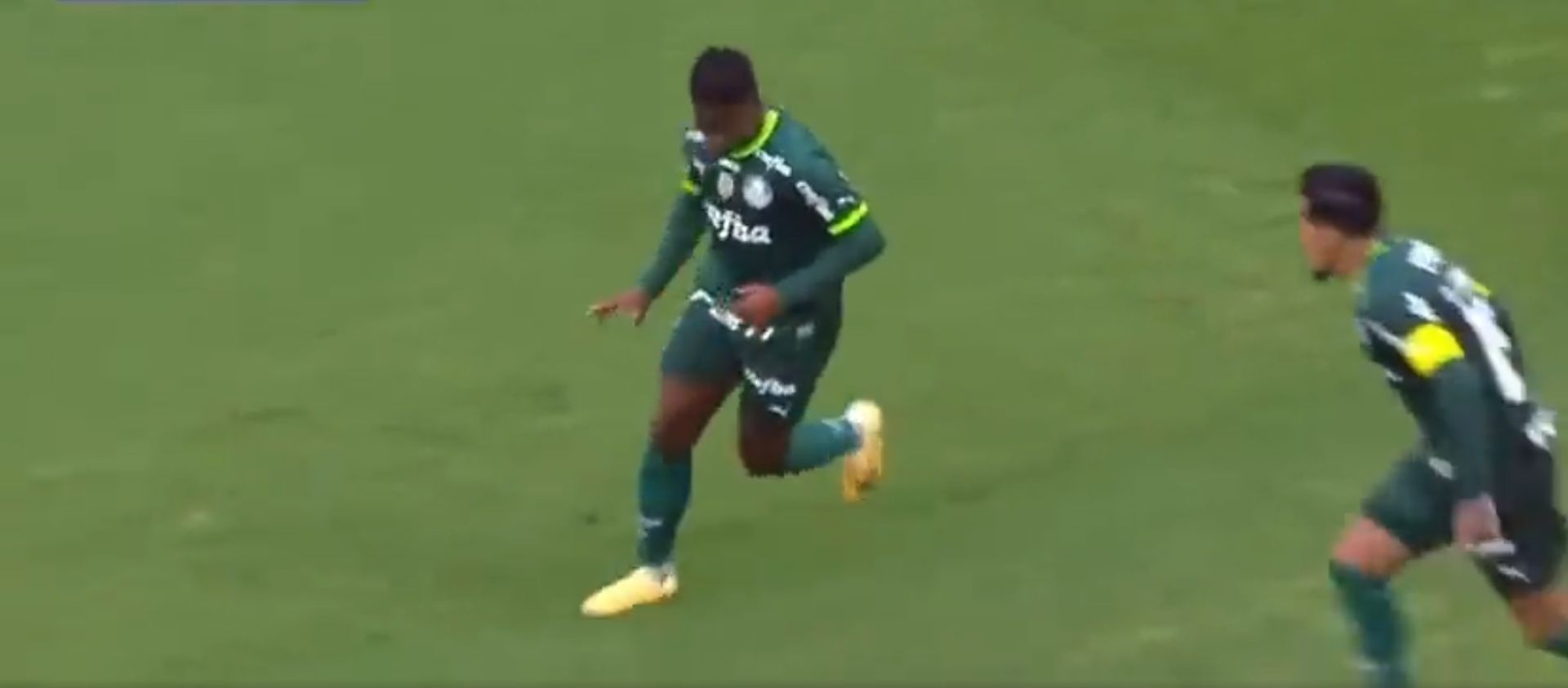 Endrick Felipe running with the ball during a soccer match