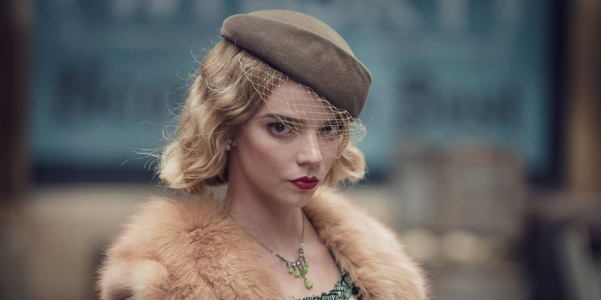 Anya Taylor-Joy in a stylish vintage outfit, posing for a portrait