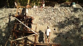 Men Gather Stones To Build Rip Rapped Structure HD Stock Video Clip