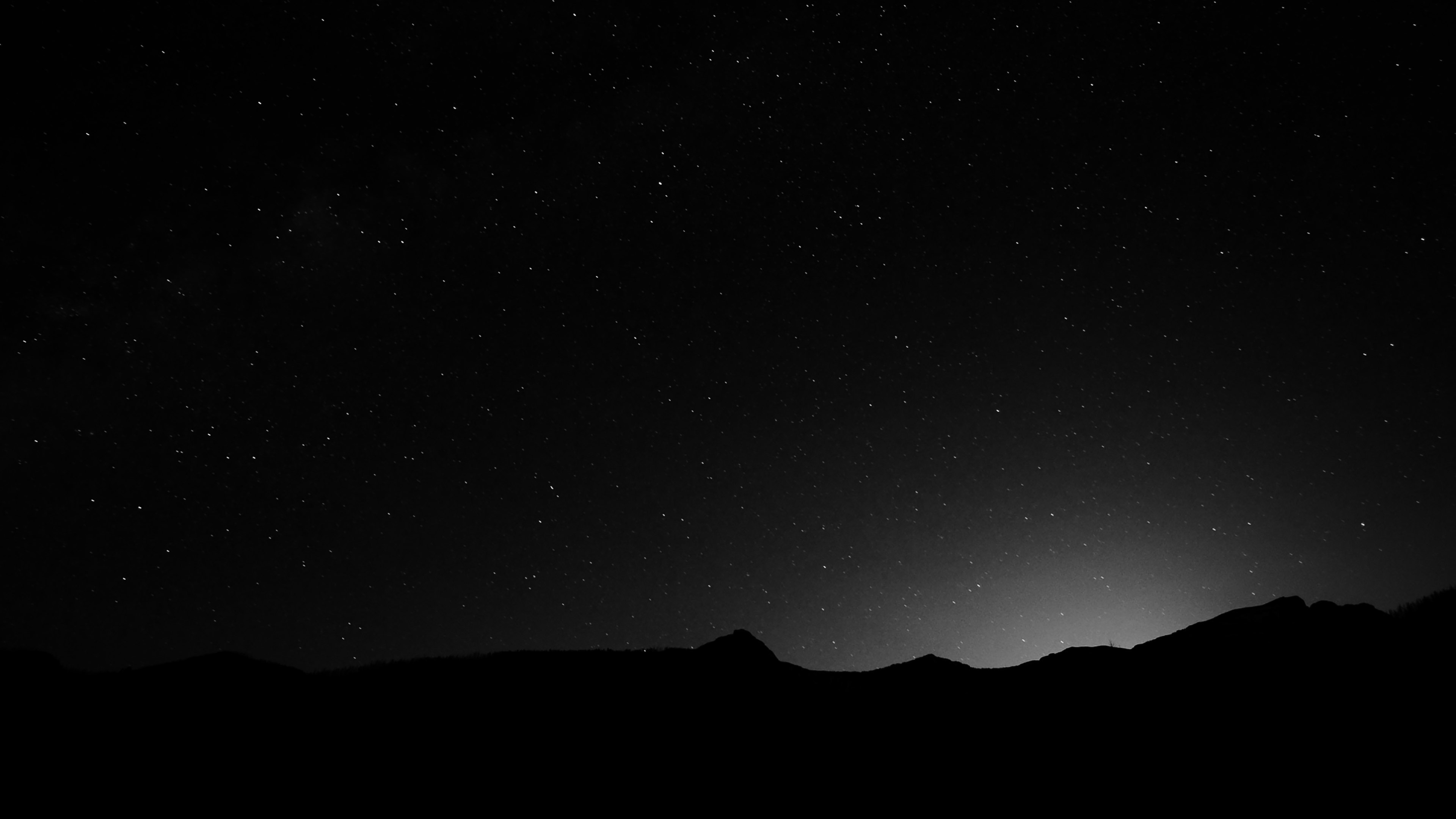 Night Sky over the Mountains Black White 4K Wallpaper
