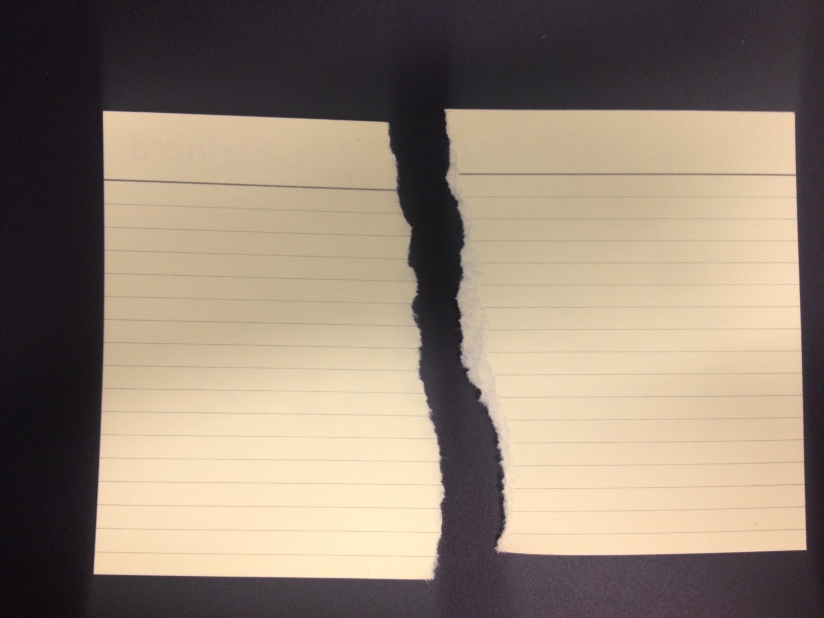 Paper Torn On Vertical Plane