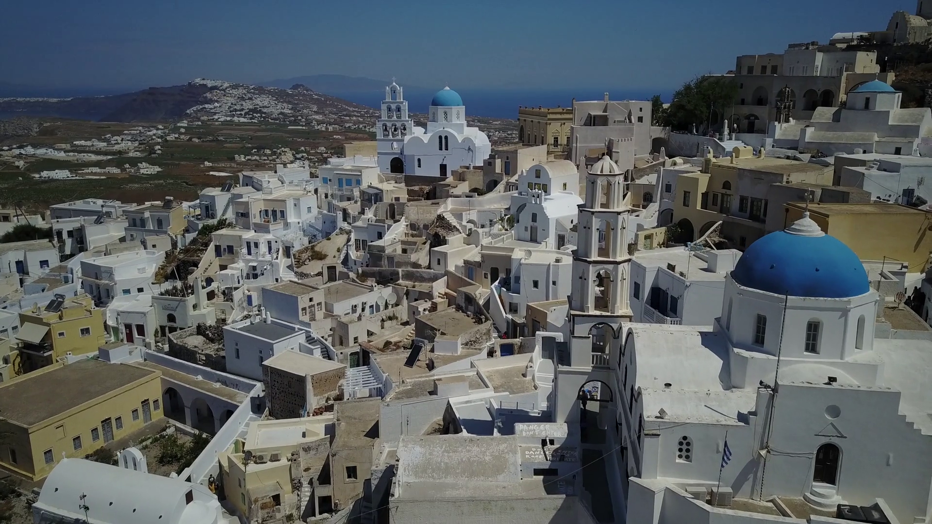 Aerial Footage Of A Church And Cliffside Village In Santorini