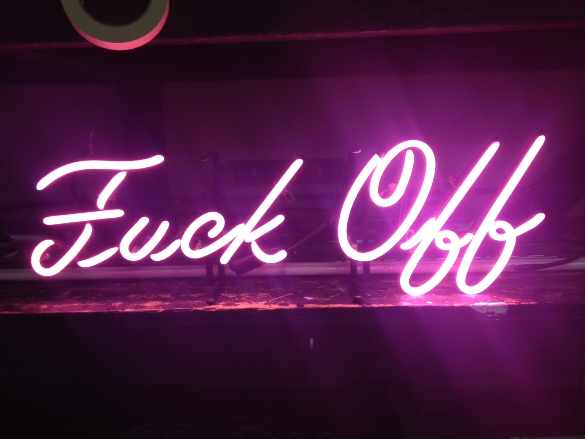 Bright pink neon sign spelling out 