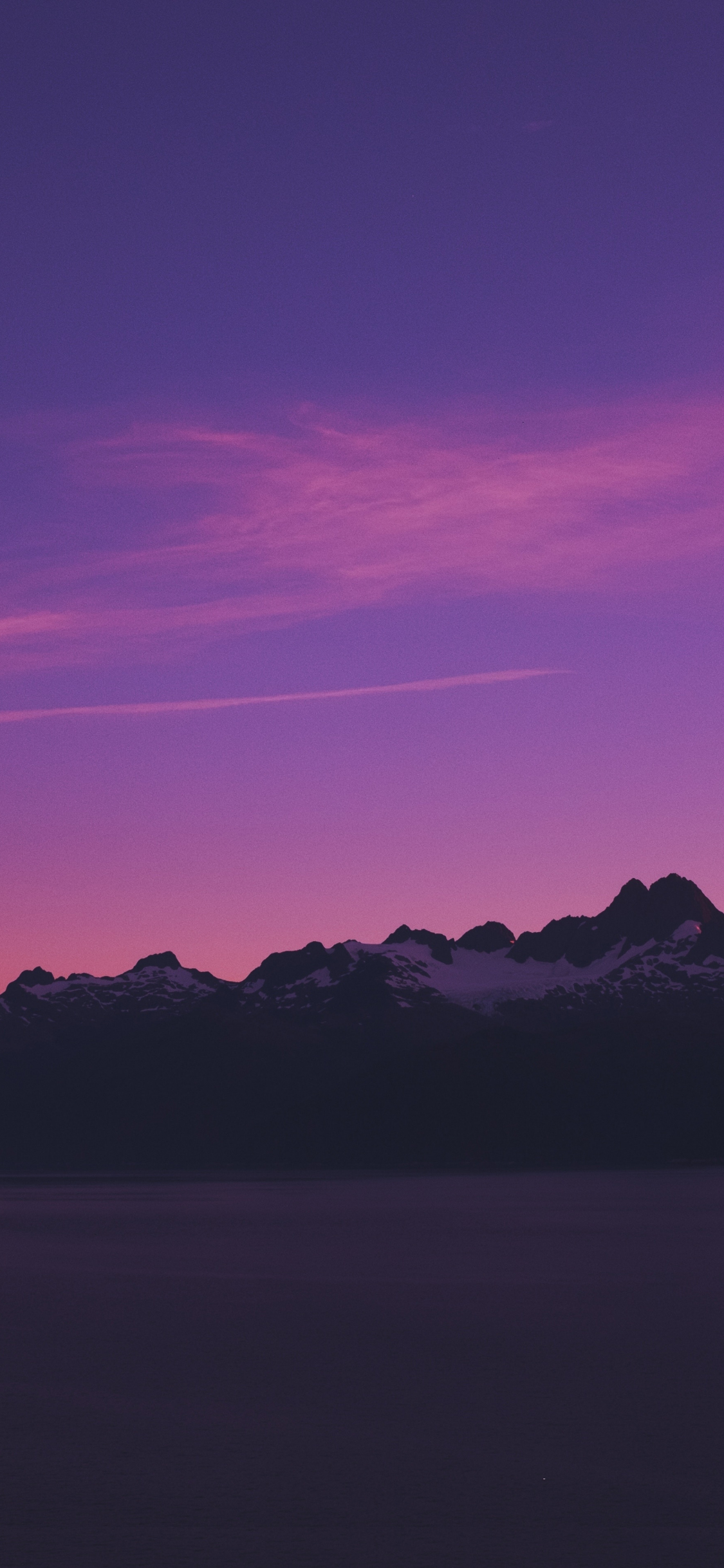 Download horizon mountains pink sky sunset 1125x2436 wallpaper
