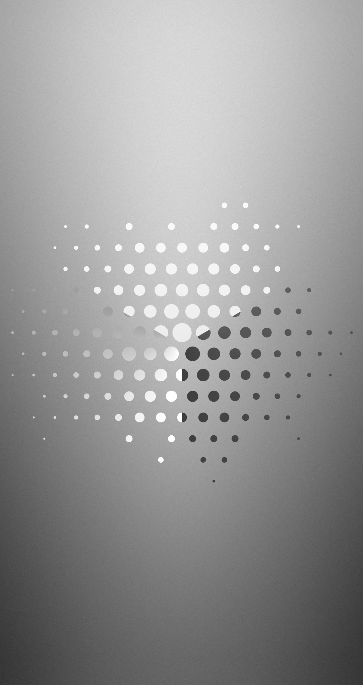 Abstract gray wallpaper with a dotted halftone pattern radiating from the center