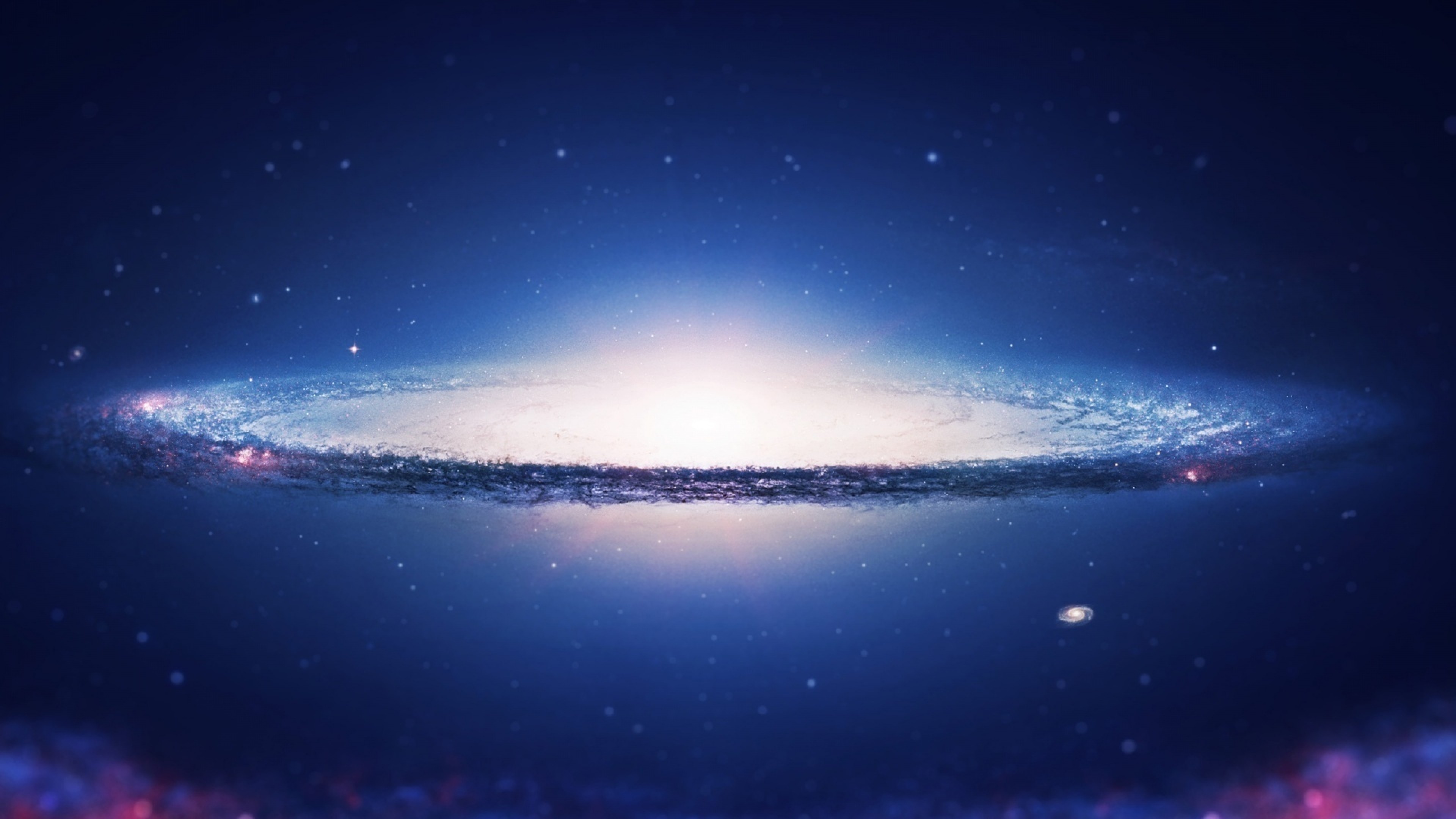 A breathtaking 4k wallpaper showcasing a majestic spiral galaxy against a backdrop of deep blue space, with countless stars and nebulae adding to its ethereal beauty