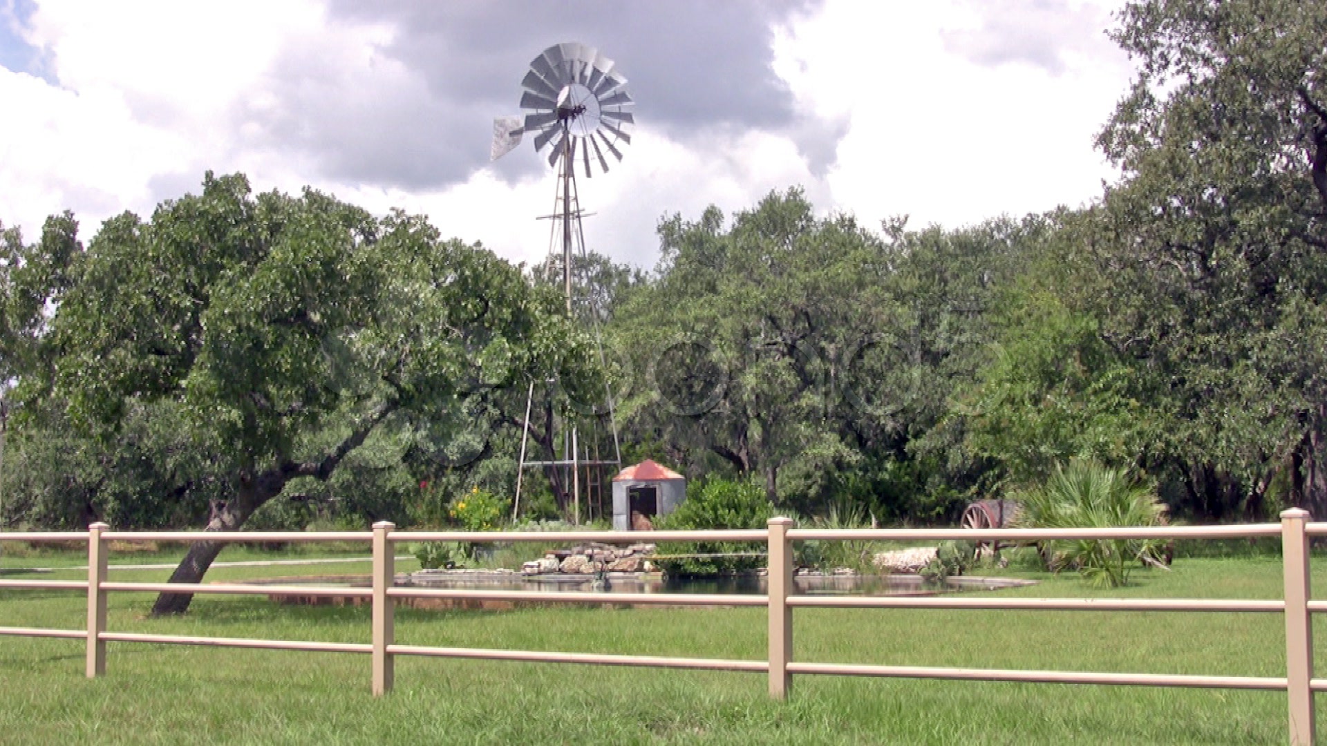 Windmill Texas Ranch Green Field Pond HD Stock Video
