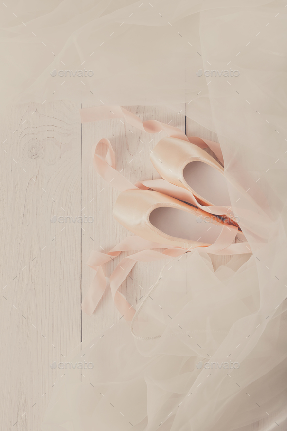Pink Ballet Pointe Shoes And Tutu On White Wood Background Stock