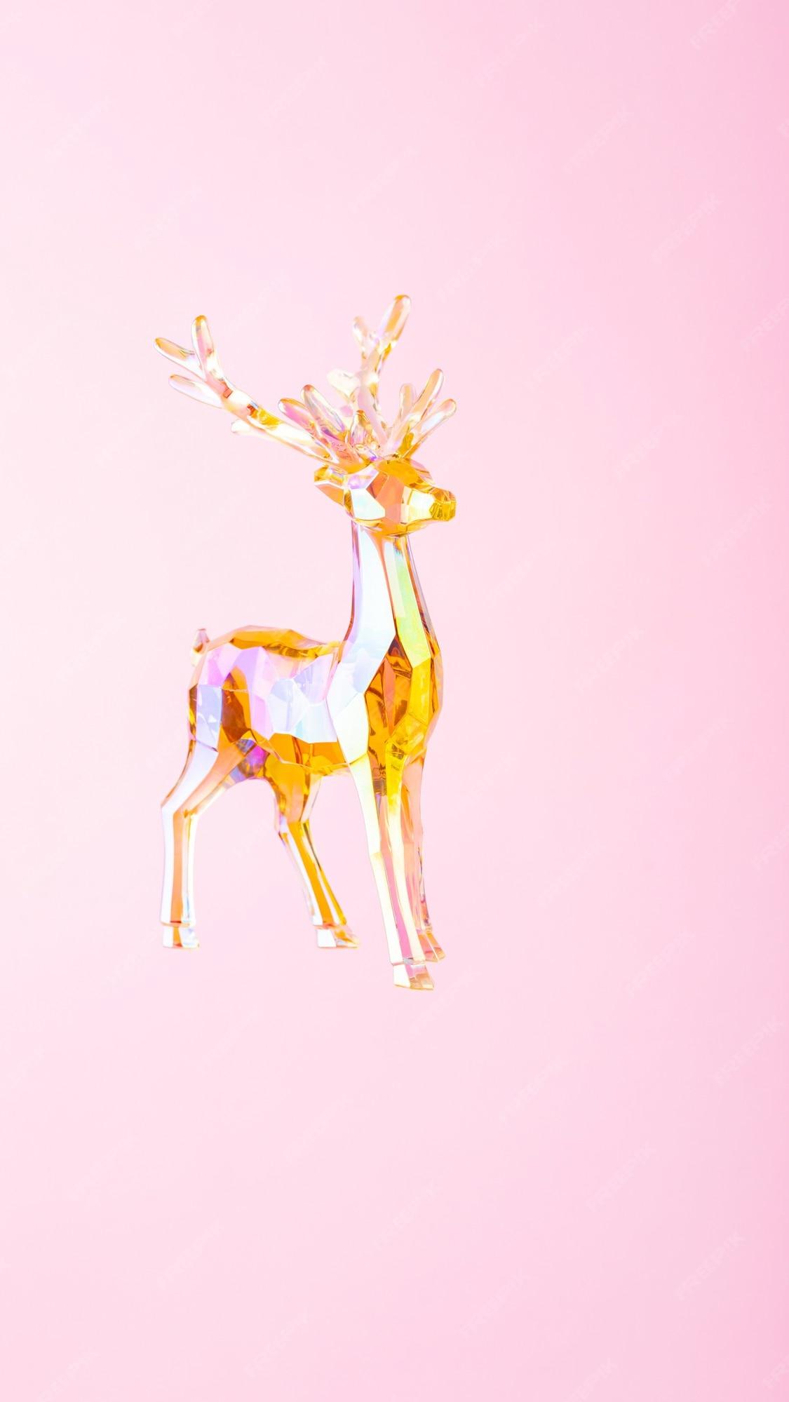 Premium Photo Christmas Decoration Deer Figurine On A Pink