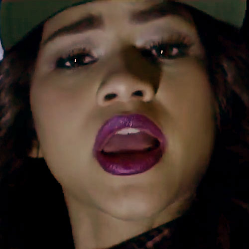 Zendaya wore a bright purple lipstick in her My Baby Remix music
