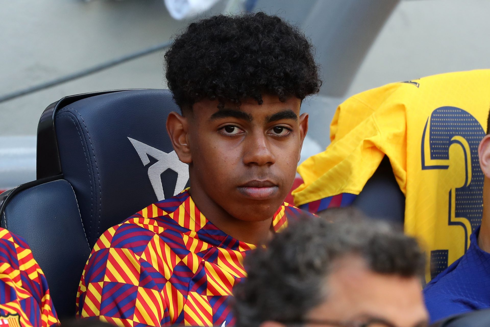 Lamine Yamal of FC Barcelona sits on the bench during a La Liga match