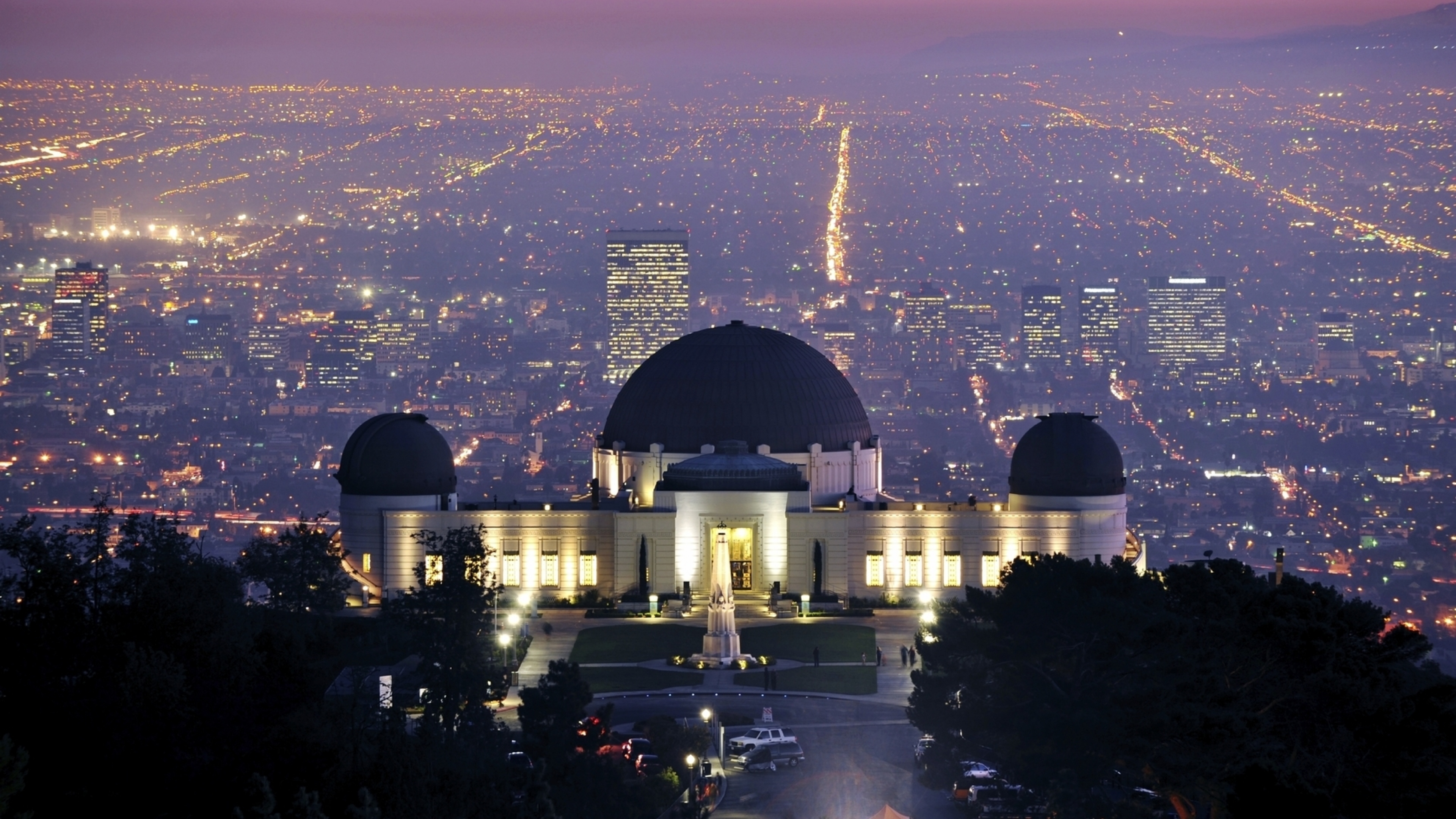 A stunning night view of the Griffith Observatory overlooking the illuminated cityscape of Los Angeles, California