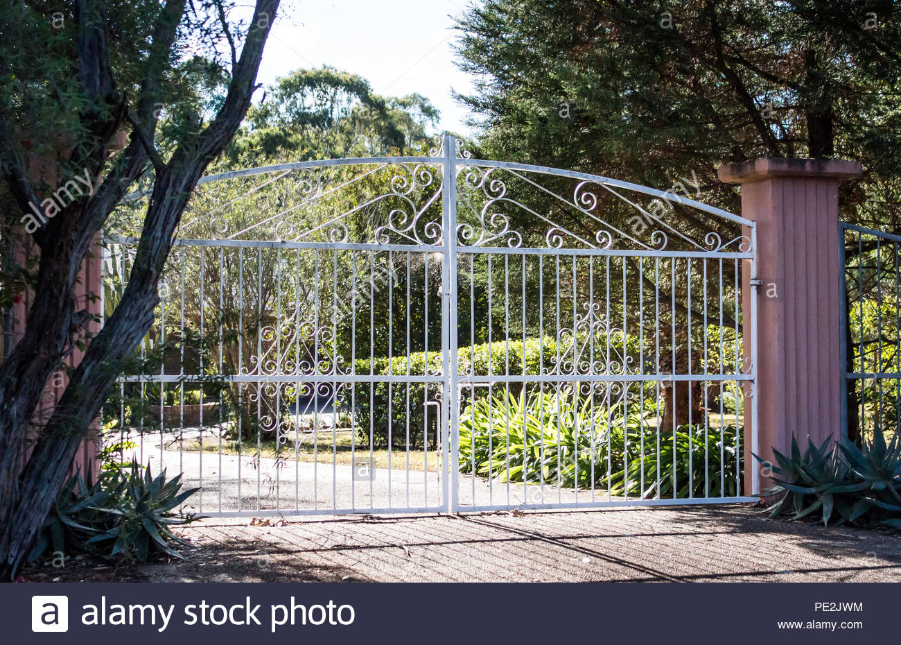 White Wrought Iron Metal Driveway Entrance Gates Set In Cement