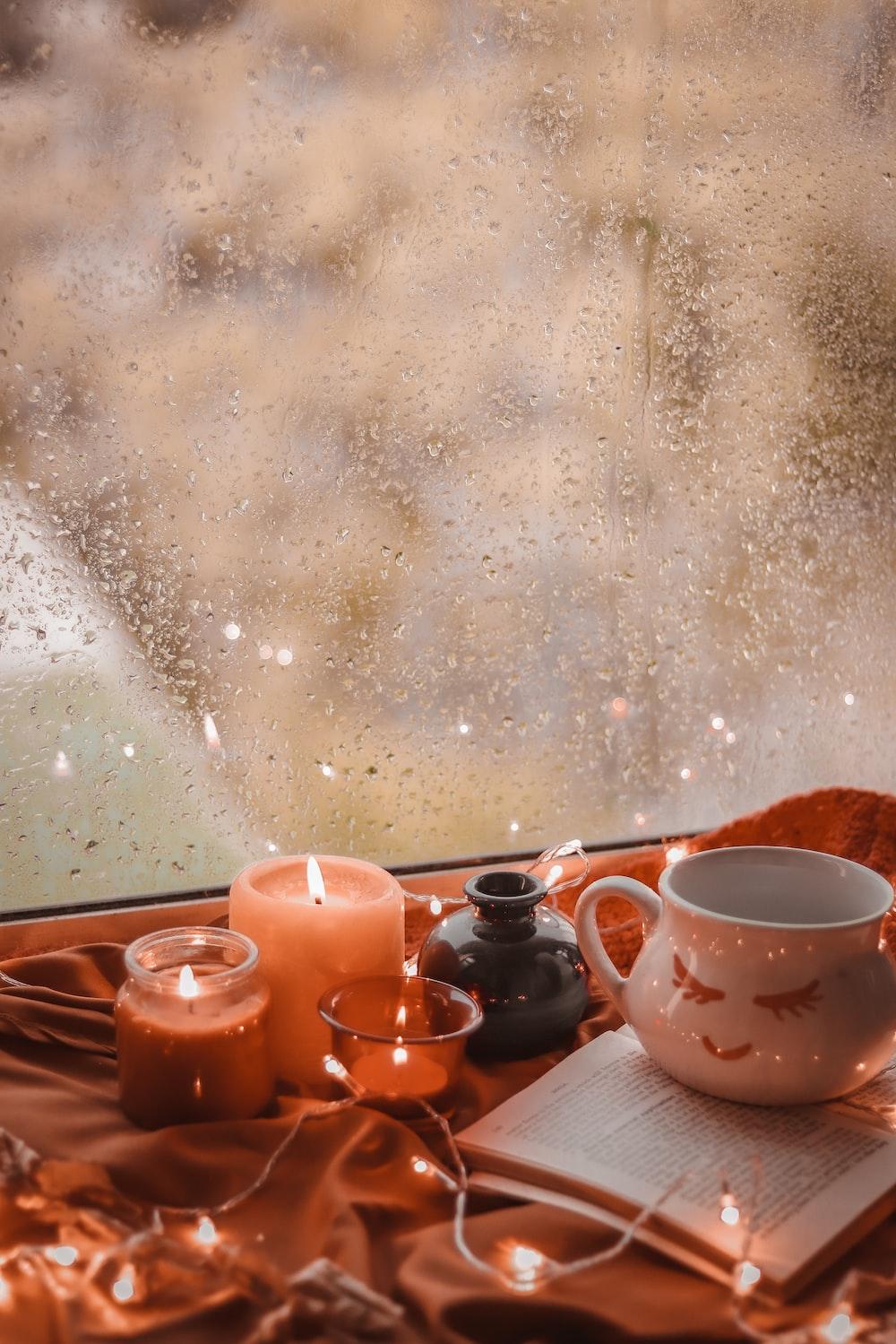 A Cup Of Coffee Sitting On Top Table Next To Window Photo
