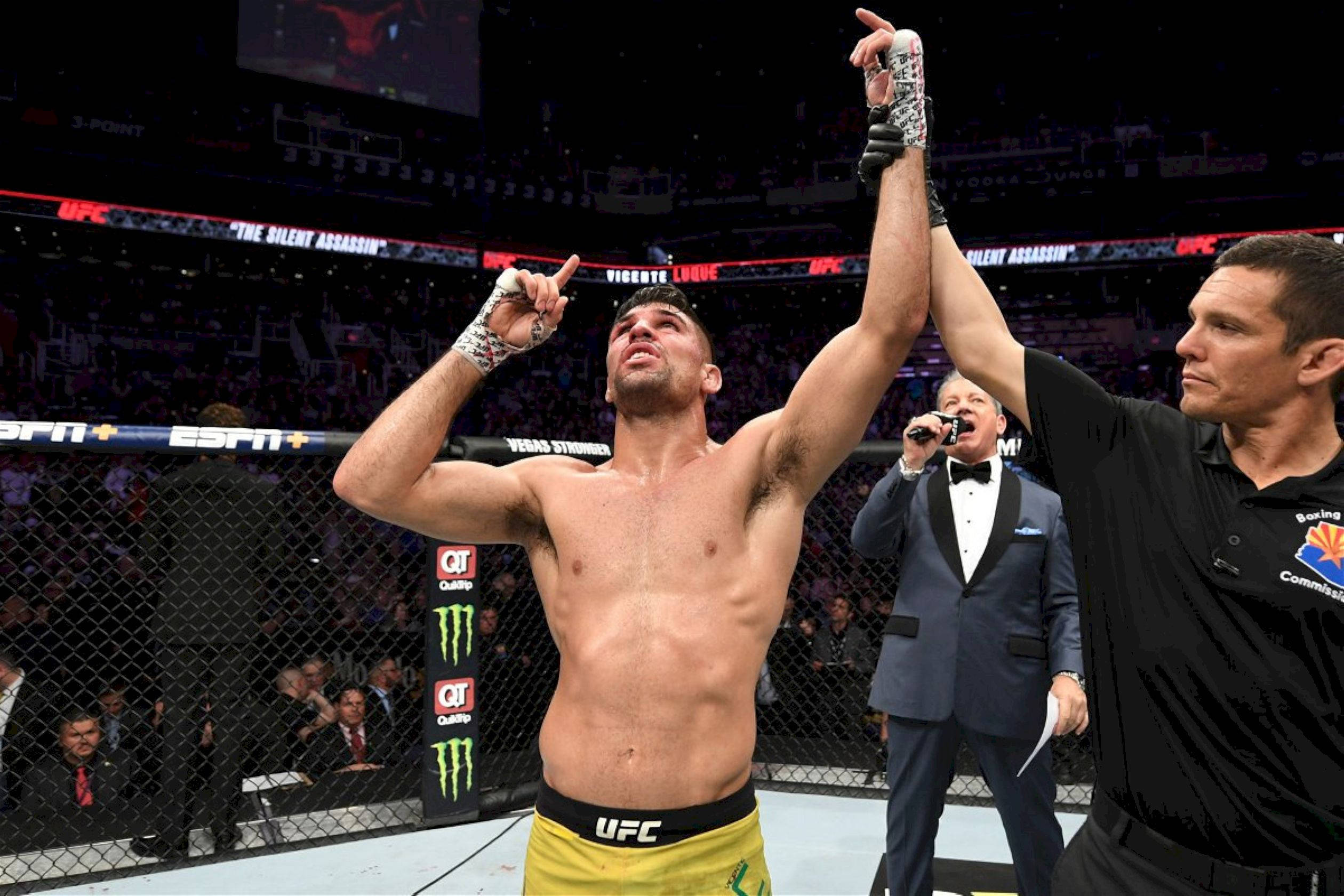 Vicente Luque Mma Fighter Gesturing Towards The Sky Wallpaper