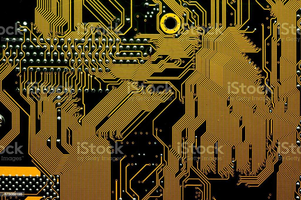 Yellow Background Of The Silhouette Of The Computer Motherboard